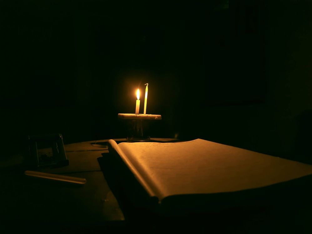 Small candle light in dark room exercise book and ... - Samsung Members