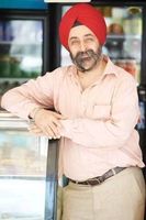 24608350-portrait-of-indian-sikh-man-seller-in-turban-with-bushy-beard-at-shop_1121_1659105101.jpg